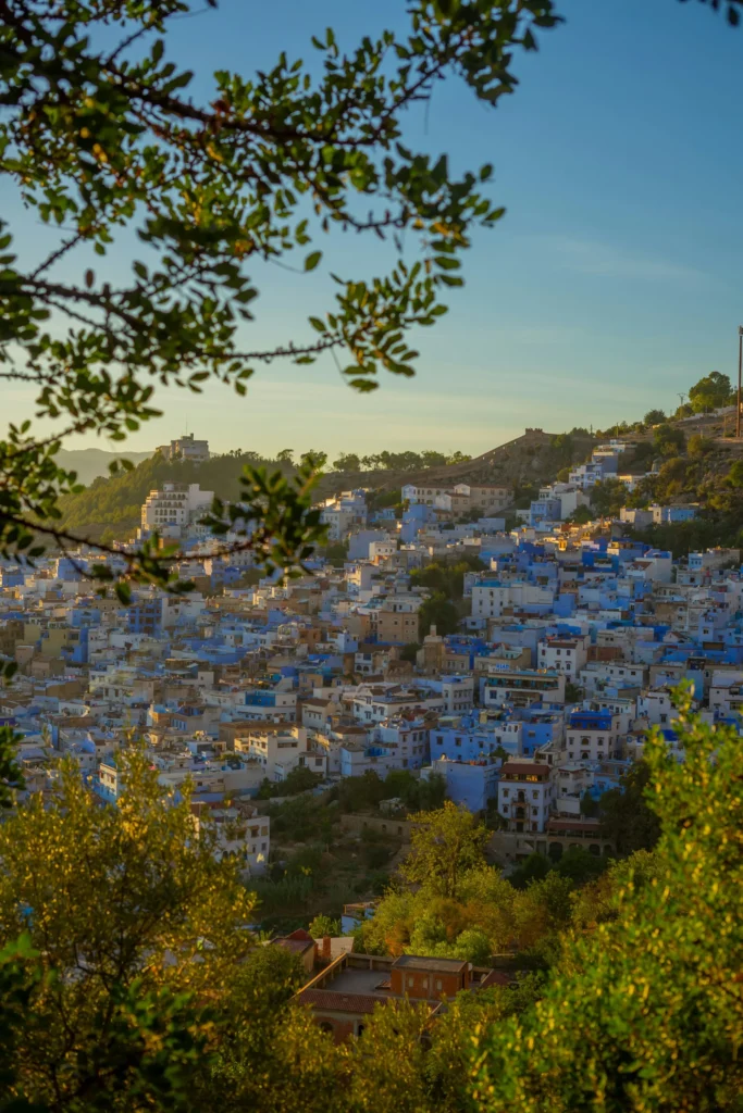 Traveler exploring the colorful streets of Chefchaouen, Morocco visit morocco
