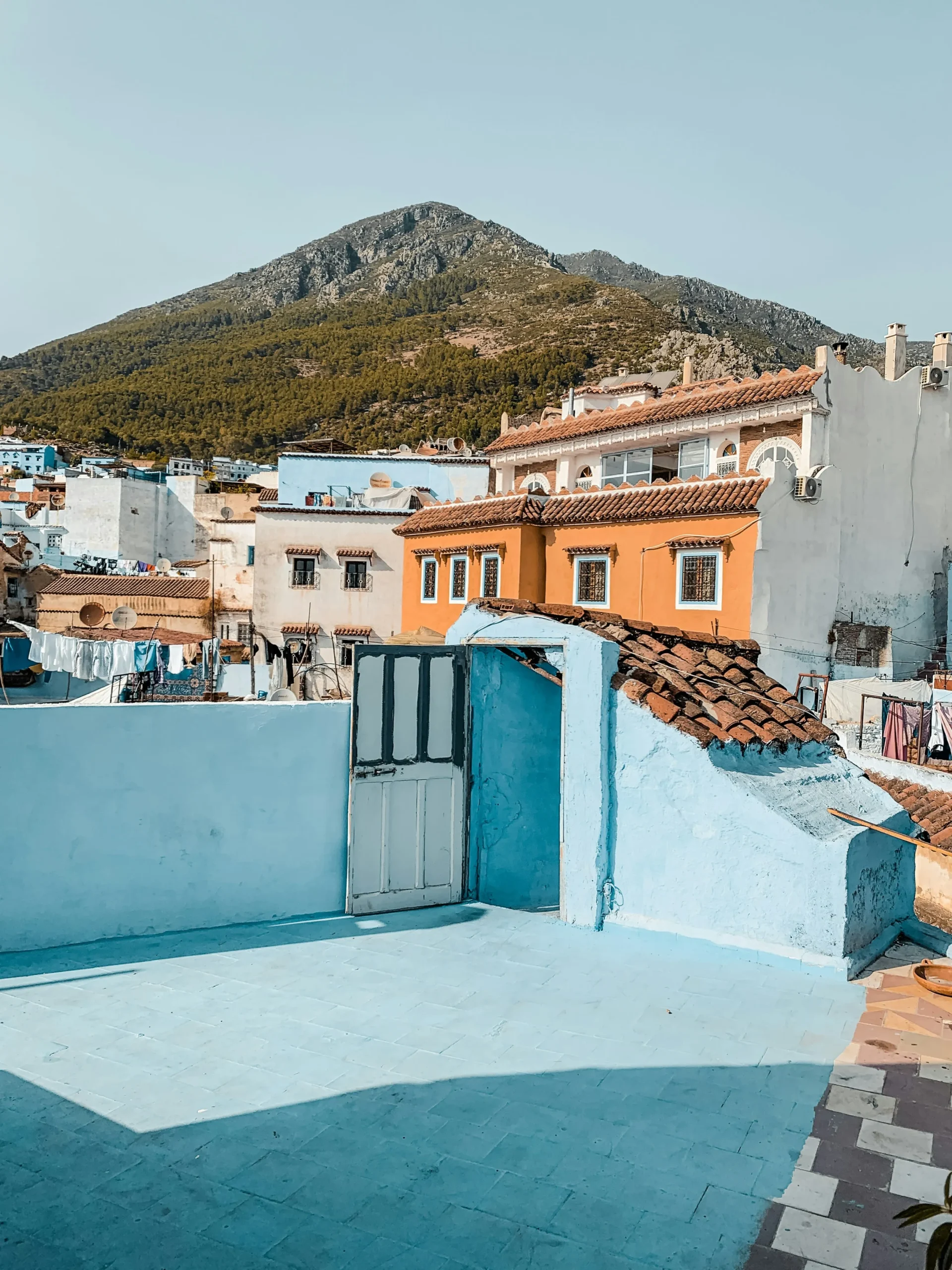 Blue Streets of Chefchaouen Scenic blue rooftop view of Chefchaouen with the Rif Mountains in