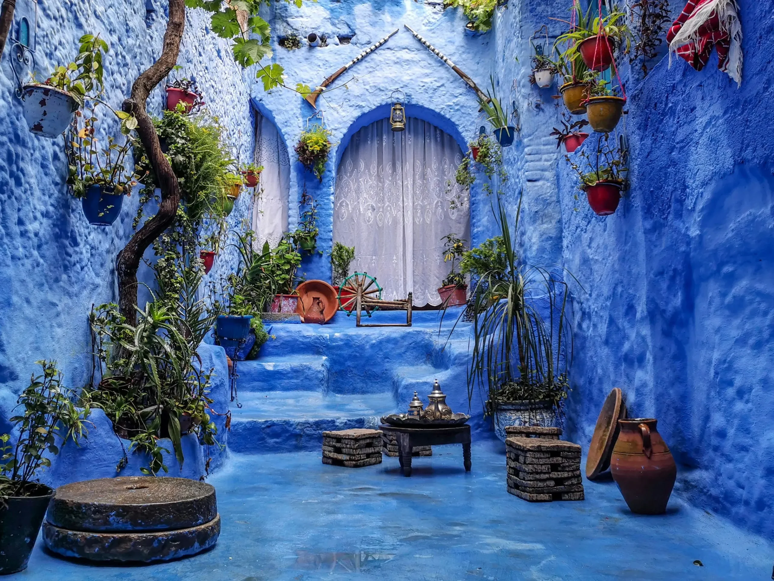 Traditional Moroccan riad with blue walls and a serene courtyard in Chefchaouen